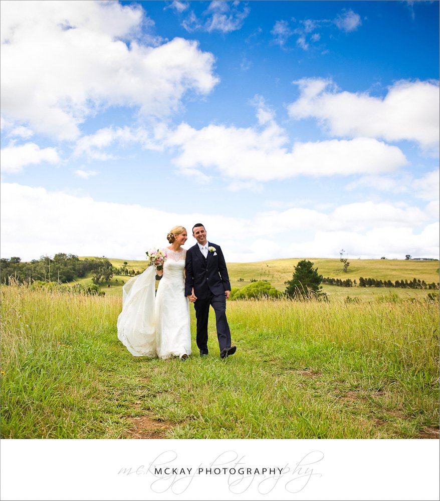 http://www.mckayphotography.com.au Bride groom grass field near Berrima