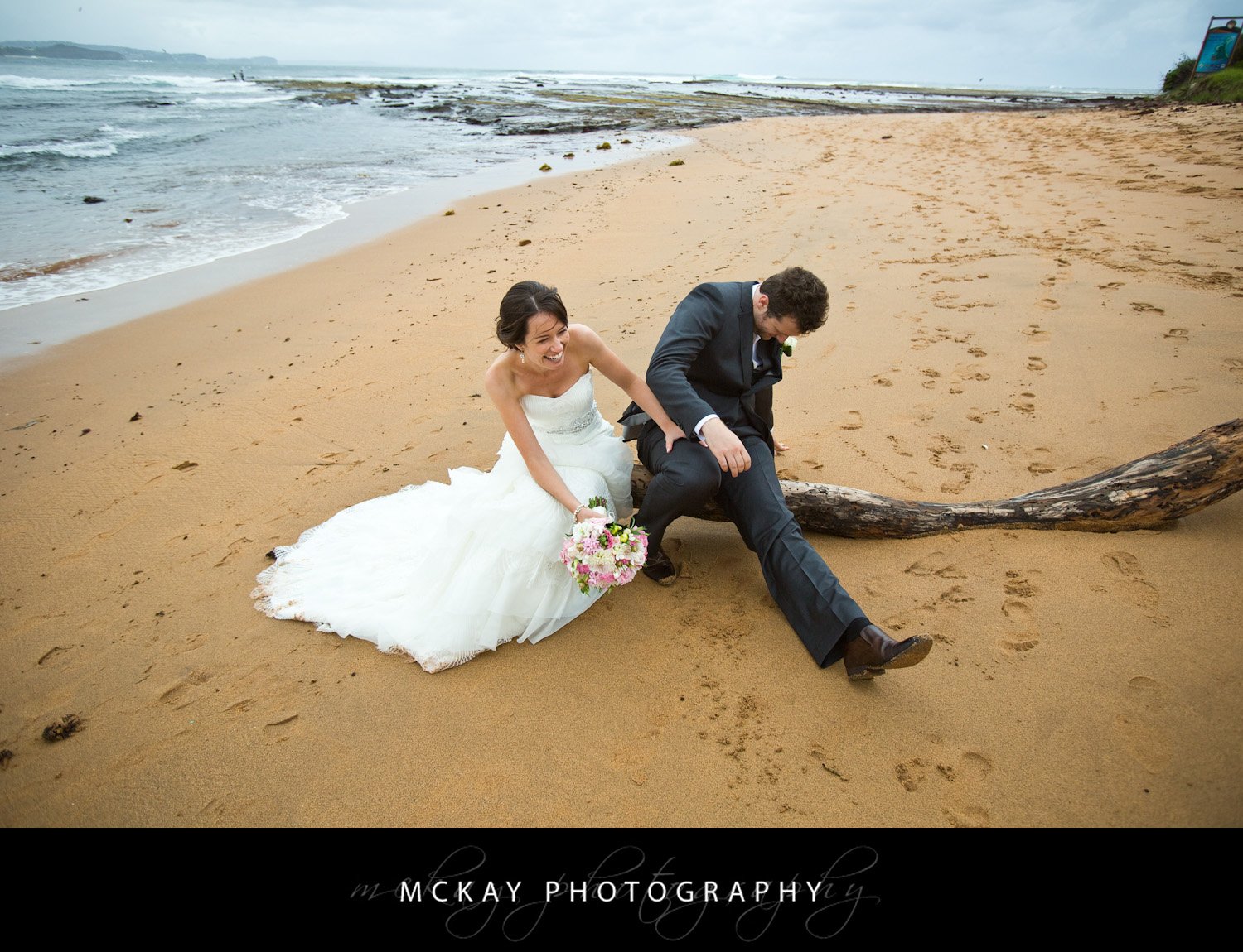 If you're going to do photos on a log - make sure you check the log wont move! Sam Thibault Wedding 